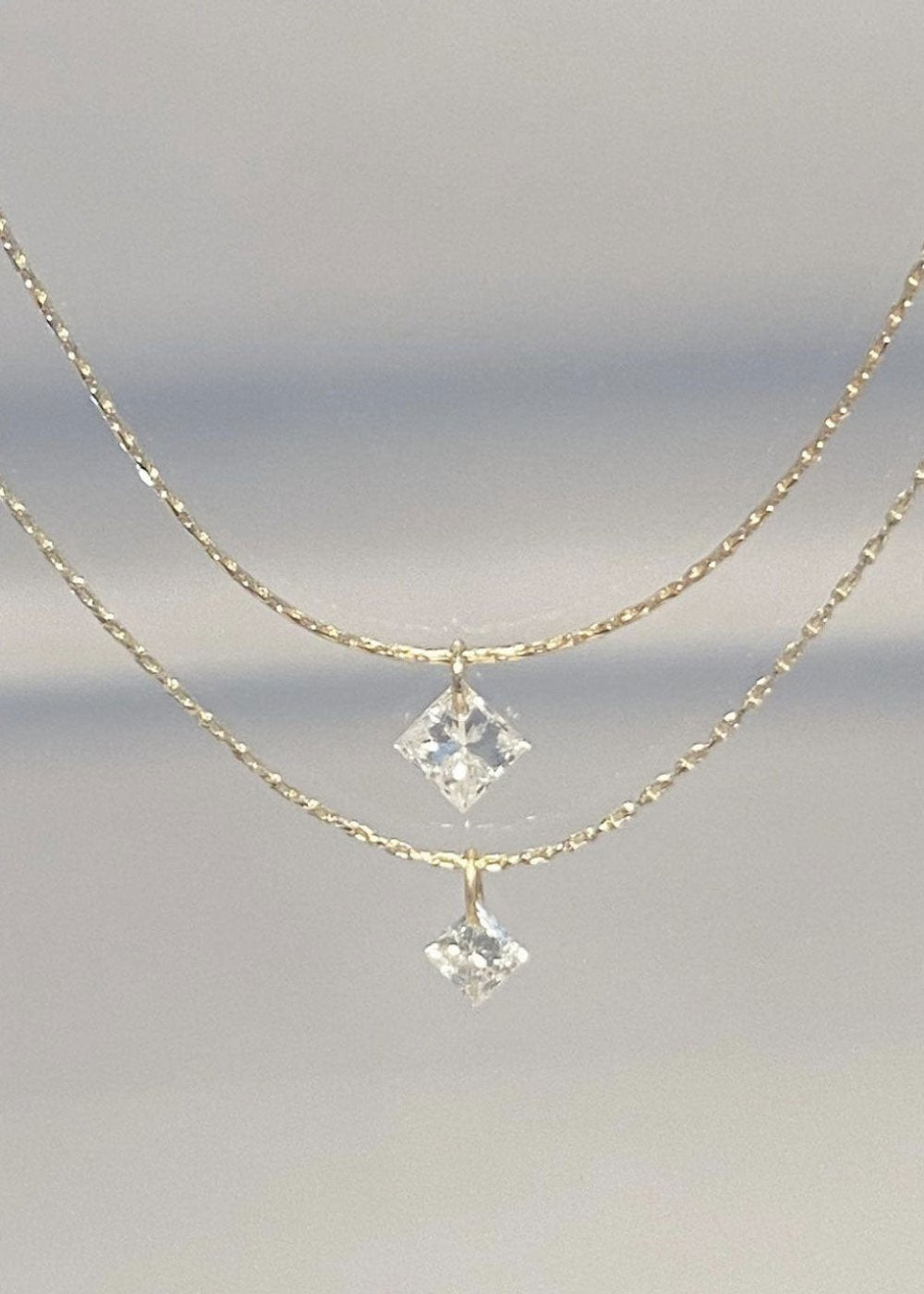 silkcord necklace 0,6ct / 0.10 ct princesscut diamond 18K yabstudio